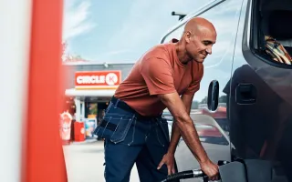 Man fueling his van