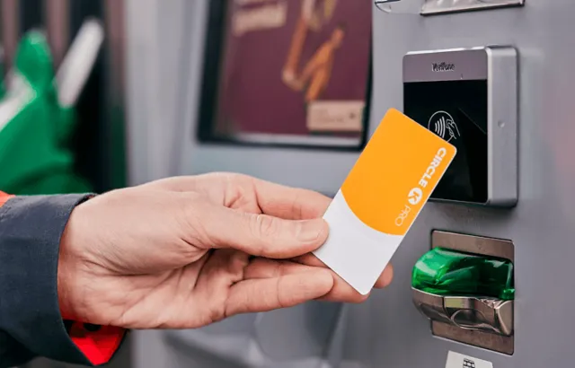 Person holding Circle K Pro card at a Circle K station